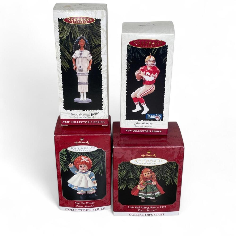 Lot 4: Hallmark Ornaments Mop Top Wendy Barbie Native Am Joe Montana Riding Hood
